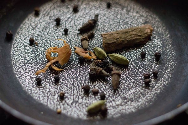 roasting whole spices in the pan. 