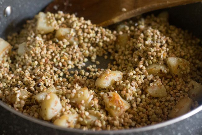 mixing buckwheat with potato mixture