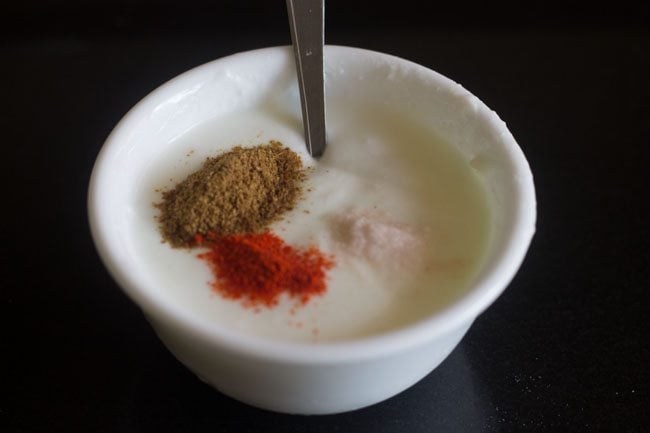ground spices and salt added to curd