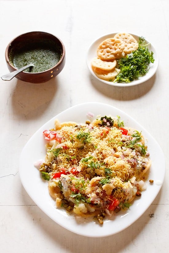 dahi papdi chaat served in a white square plate.