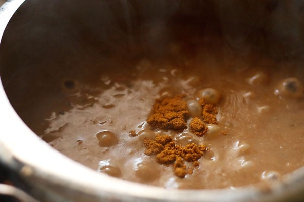 adding garam masala powder to dal