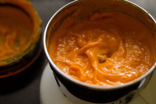 mango purée in base of grinder for making mango panna cotta recipe.