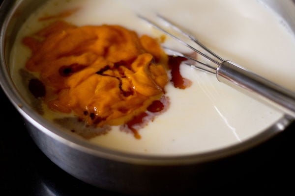 mango purée and vanilla extract added to vegetarian panna cotta mixture.