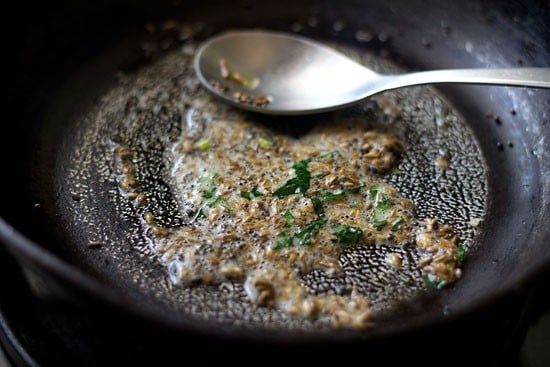 sautéing mustard seeds, cumin seeds and chopped curry leaves in hot oil. 