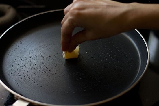 greasing hot pan with oil. 