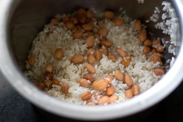 rinsed rice and raw peanuts for bisi bele bath recipe. 
