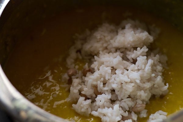 cooked rice and peanuts added to mashed lentils. 