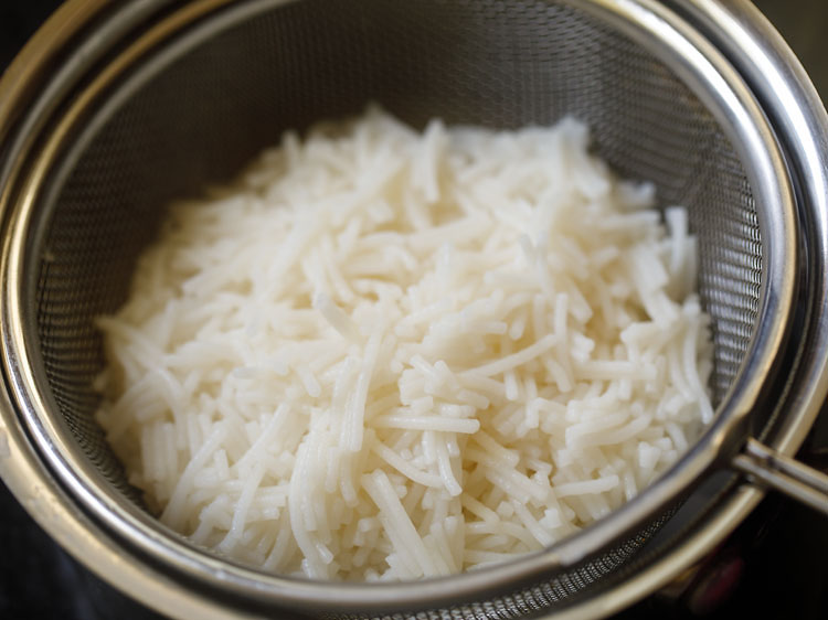 falooda sev being strained in a colander or strainer