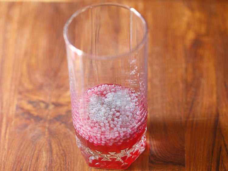 adding soaked sabja seeds in the same glass