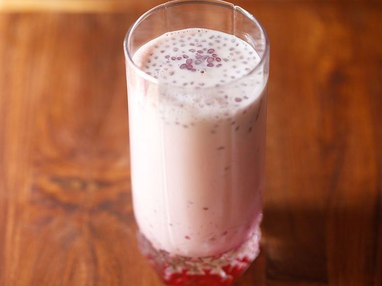 pouring chilled milk in the same glass