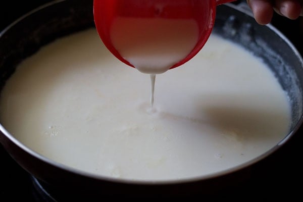 adding starch slurry to kulfi ice cream mixture