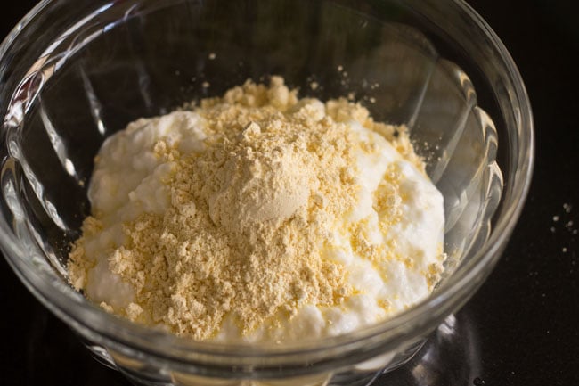 Gram flour is added to the curd. 