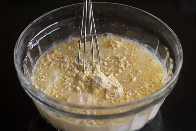 mixing the ingredients with a wired whisk. 