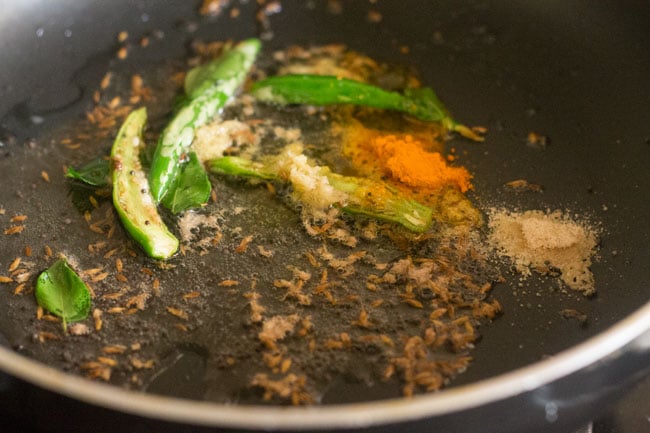 turmeric powder and asafoetida added to the pan. 