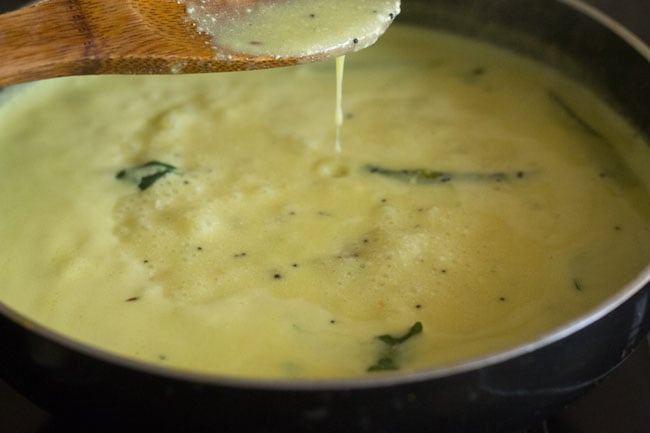 cooking maharashtrian kadhi. 