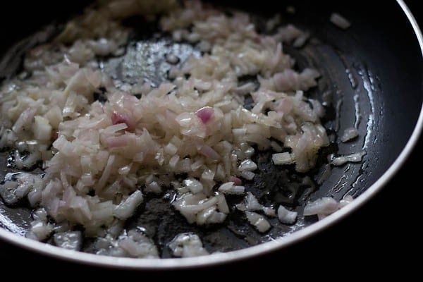 chopped onions added to hot oil in a pan. 