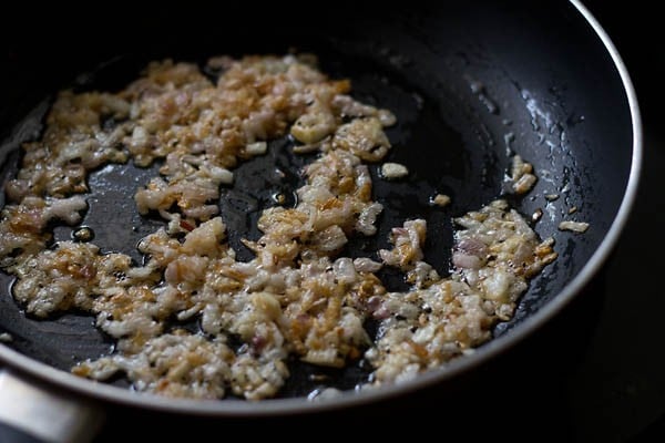 sautéing onions till they turn golden. 