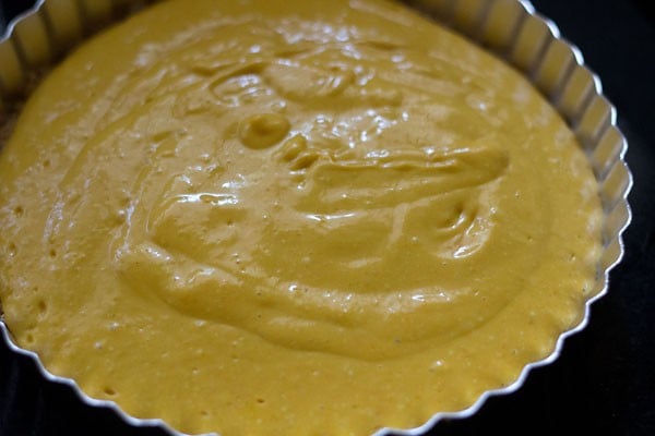pour the mango cheesecake mixture over the set crust.