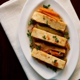 paneer jalfrezi served on a white plate.