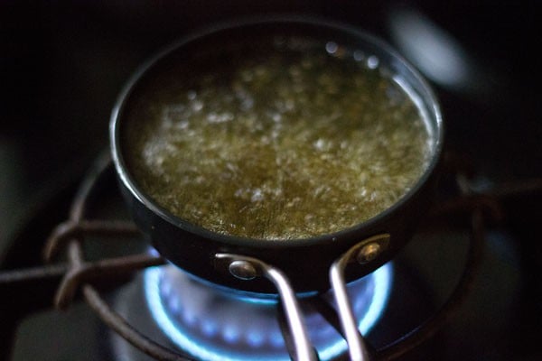 spluttering mustard seeds and fenugreek seeds in hot sesame oil. 