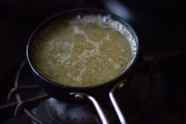 adding asafoetida in the hot oil. 