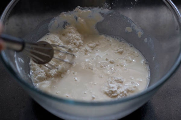 whisking the flour mixture for making pizza pockets. 