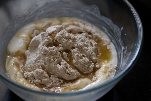 olive oil, salt and whole wheat flour added to sponge mixture for making pizza pockets. 