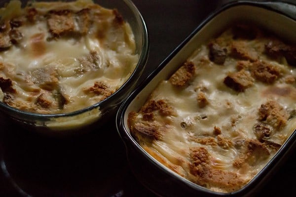 eggless bread butter pudding after coming out of the oven - it is golden brown and clearly set on top.