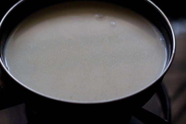 warming the eggless custard mixture over a low flame.