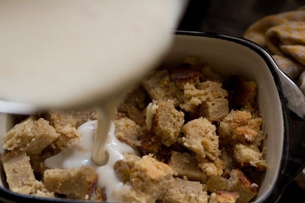 pour custard mixture over buttered bread pieces.