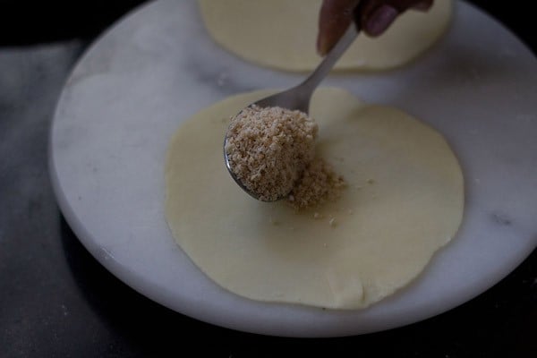 adding coconut stuffing in the center