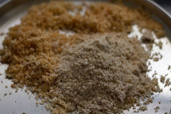 adding ground dry fruits powder to the sesame seeds and coconut mixture