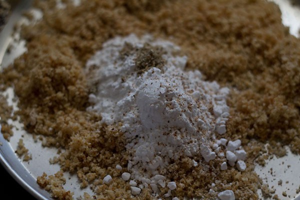add powdered sugar, nutmeg powder and cardamom powder and then mix well