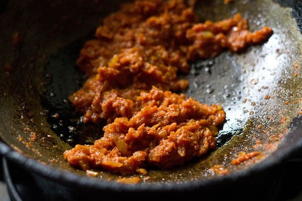 mixing spices with the masala