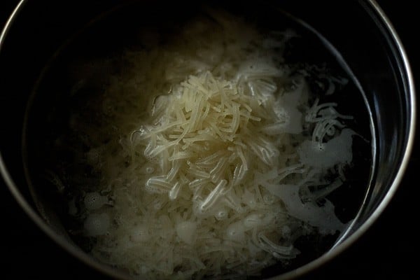 cooking falooda sev in hot water. 