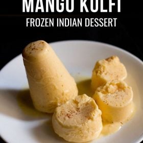 mango kulfi sliced and whole served on a white plate with text layovers.