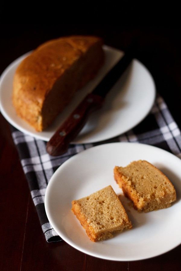 eggless mawa cake slices served on a white plate.