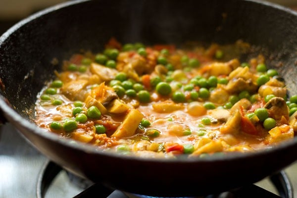 sauteing matar mushroom masala