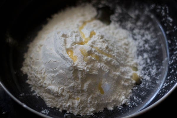 all-purpose flour, salt and oil taken in a black mixing bowl