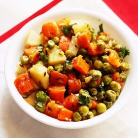 aloo gajar matar served in a white bowl.dry gajar aloo matar recipe