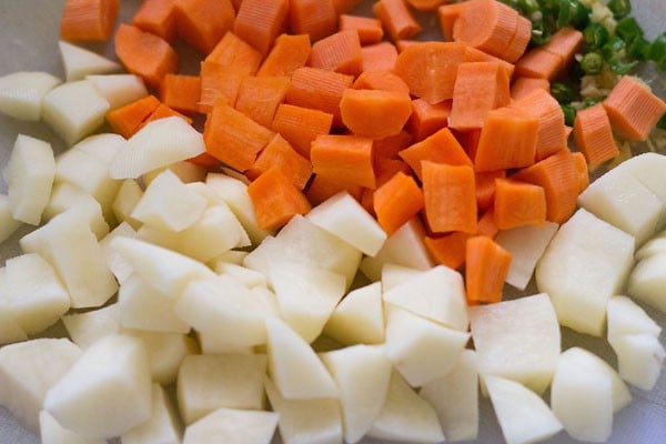 chopped potatoes, chopped carrots and chopped green chilies. 