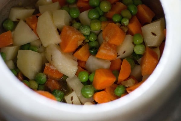 salt and water added to the vegetables and mixed.