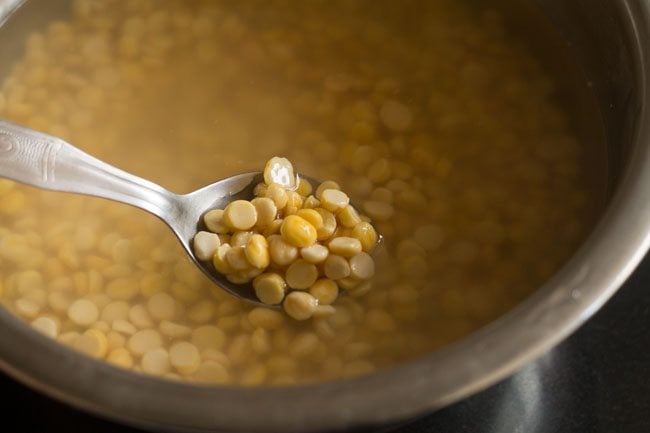 Soak chana dal in water. 