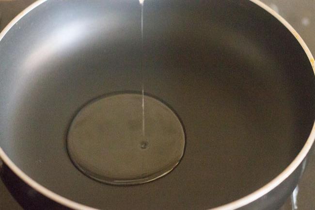 adding oil in a hot pan. 