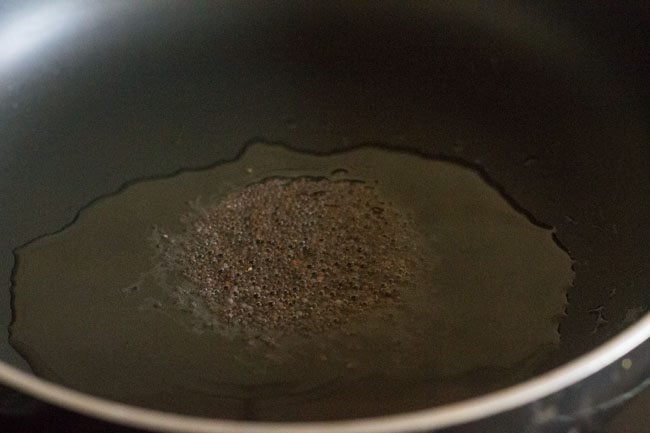 Crack mustard seeds in hot oil. 