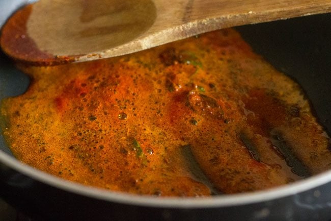 stirring the spice powders and curry leaves well. 