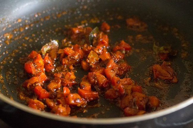 Stir tomatoes with spice mixture. 