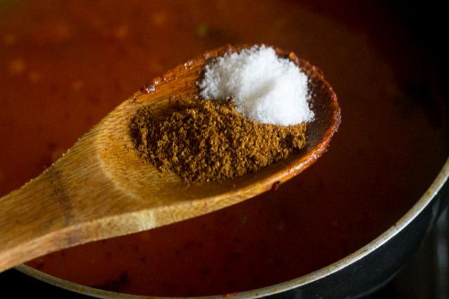 adding goda masala and salt to the pan. 