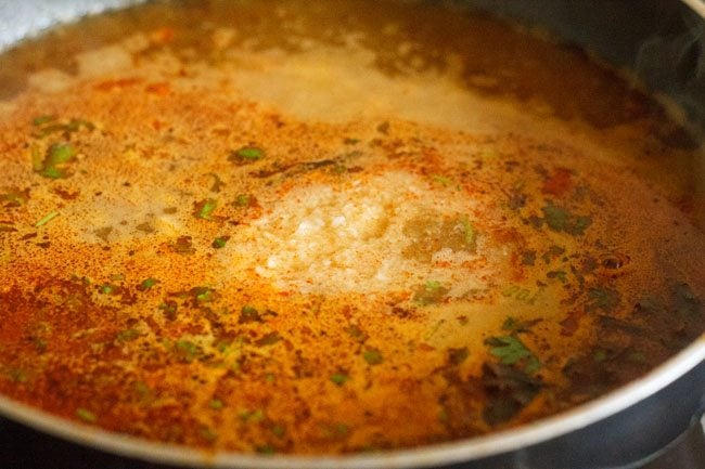 desiccated coconut added to boiling amti. 