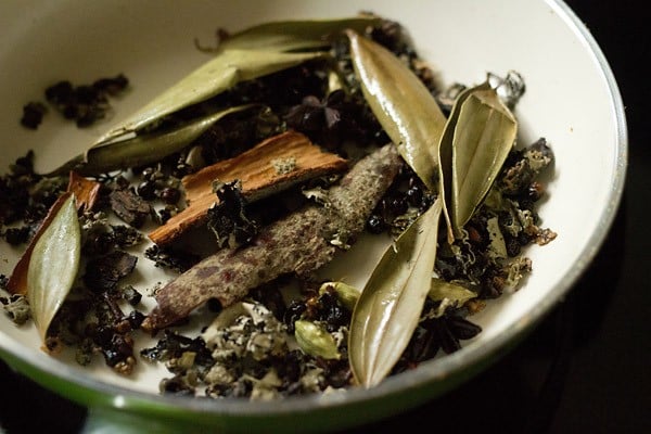 roasting aromatic whole spices for Maharashtrian goda masala recipe.